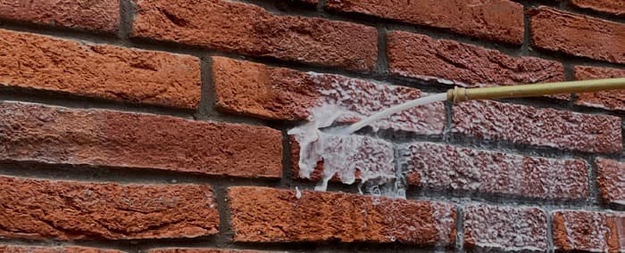 Buitenmuren en gevels impregneren (hydrofoberen) tegen vochtdoorslag